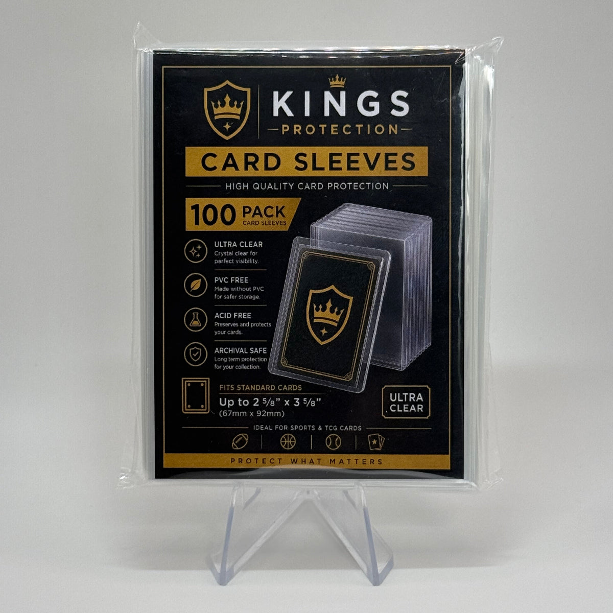 Kings Protection 100-pack of ultra clear card sleeves in retail packaging, displayed on a clear acrylic stand against a neutral gray background.